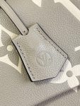 louis-vuitton-madeleine-mm-bicolor-monogram-empreinte-leather-handbags-M46041_PM2_Front-view.png